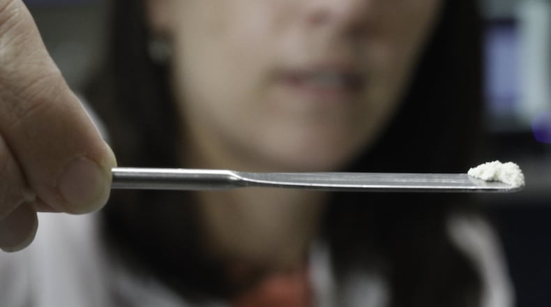 ARCHIVE PHOTO: Brooke Ehlers, technical leader of the Miami Valley Regional Crime Laboratory’s Chemistry Section, tests a drug sample for fentanyl. The highly potent synthetic opioid — often cut with heroin or used alone — has been on the streets for more than a year in the Dayton area and is responsible for an increasing number of overdose deaths. CHRIS STEWART / STAFF