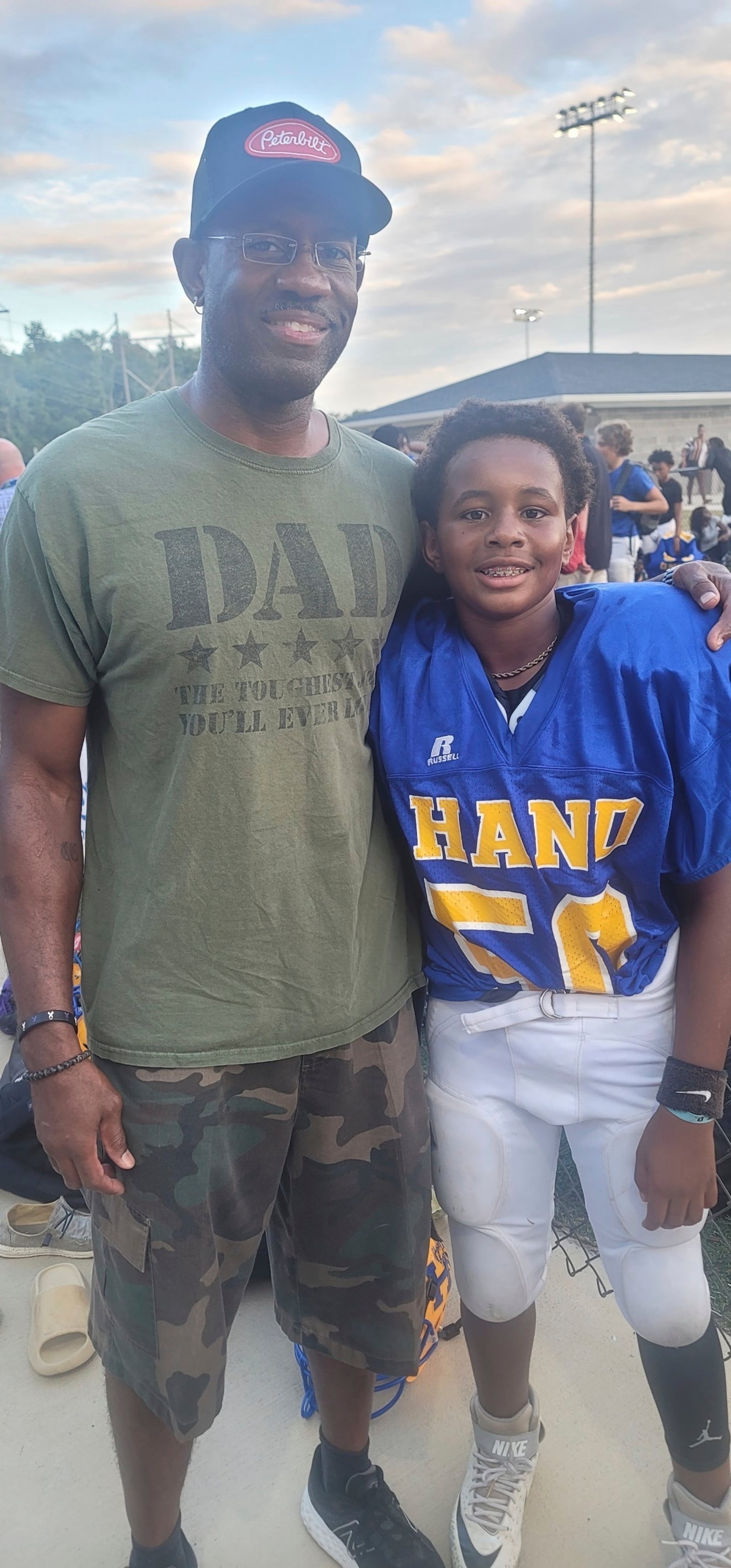 This family photo shows Clarence Carr and his son Jaysen at his middle school football game in Columbia, S.C. (Carr Family via AP)
