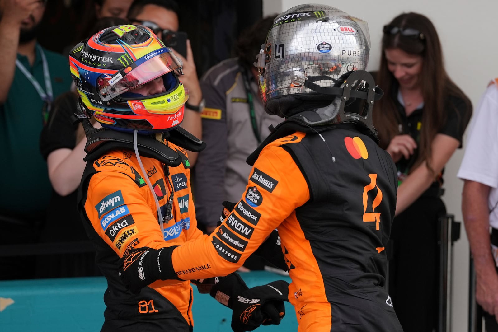 McLaren drivers Oscar Piastri of Australia, left, and Lando Norris of Britain celebrate after a first and second place finish in the Formula One Miami Grand Prix auto race Sunday, May 4, 2025, in Miami Gardens. Fla. (AP Photo/Rebecca Blackwell)