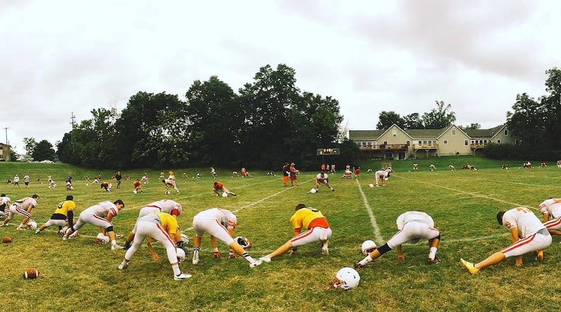 Wittenberg players stretch after practice on Monday, Aug. 28, 2017, in Springfield. David Jablonski/Staff