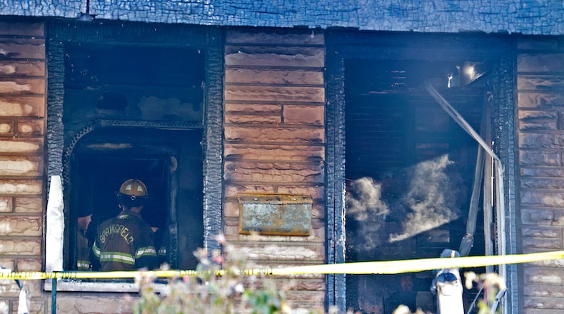 Two people were killed in a house fire early Saturday, Dec. 14, 2024 in the 1800 block of South Center Blvd. As Springfield firefighters tried to enter the house, one firefighter's legs went through the floor, so they attacked the fire from the outside. BILL LACKEY/STAFF