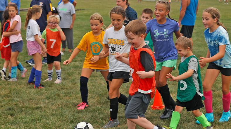 Dream Soccer players in the younger age group practice Thursday, August 15, 2024 at National Trail Soccer Complex for the 18th Annual Tournament on Friday. BILL LACKEY/STAFF