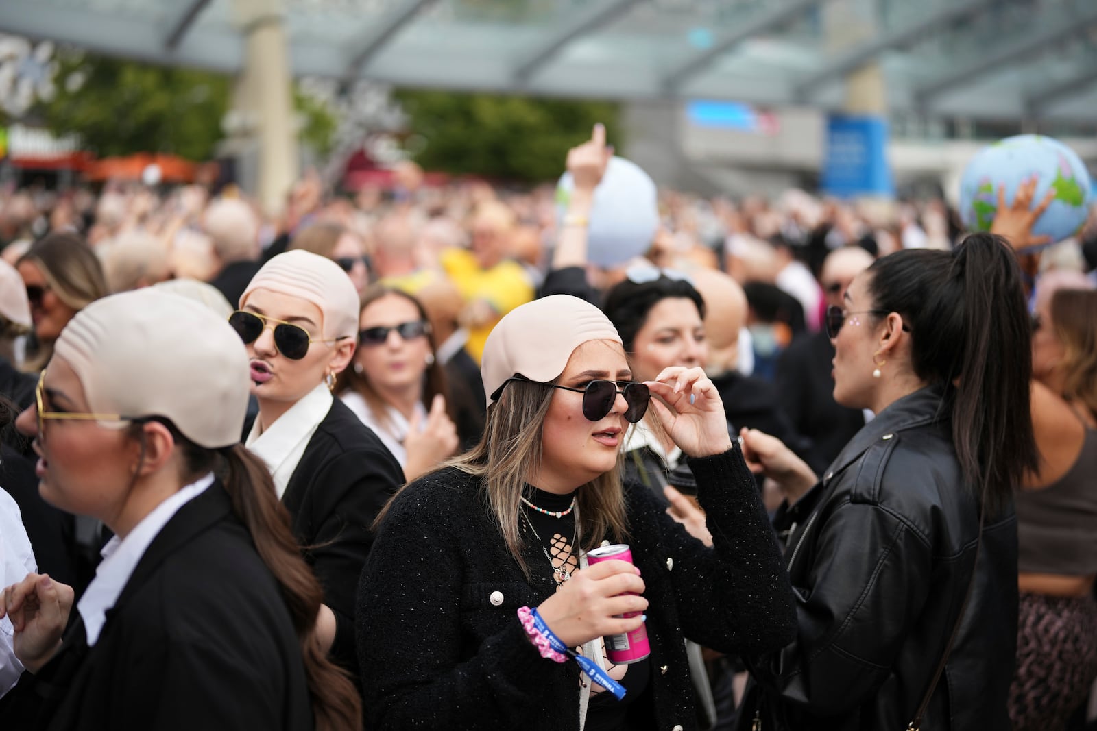Fans gather in front of the O2 Arena prior to a performance by Pitbull on Monday, June 9, 2025, in London. (Photo by Scott A Garfitt/Invision/AP)