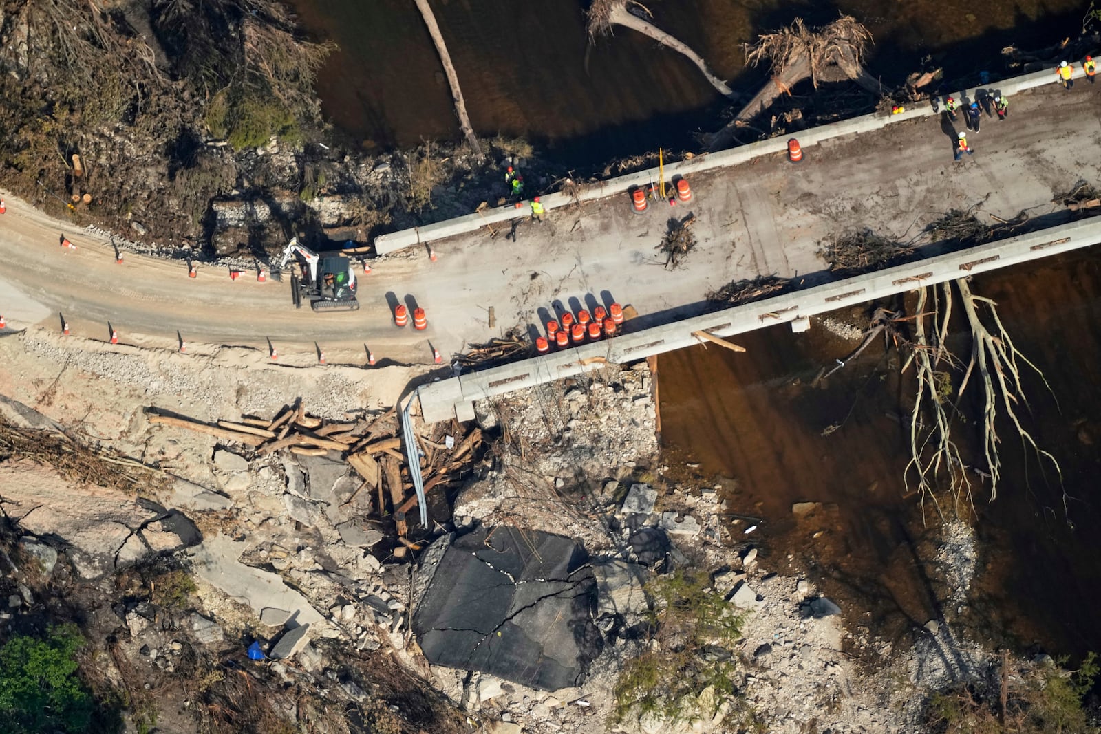 This aerial photo shows damage from flash floods along the Guadalupe River in Ingram, Texas, Thursday, July 10, 2025. (AP Photo/Gerald Herbert)
