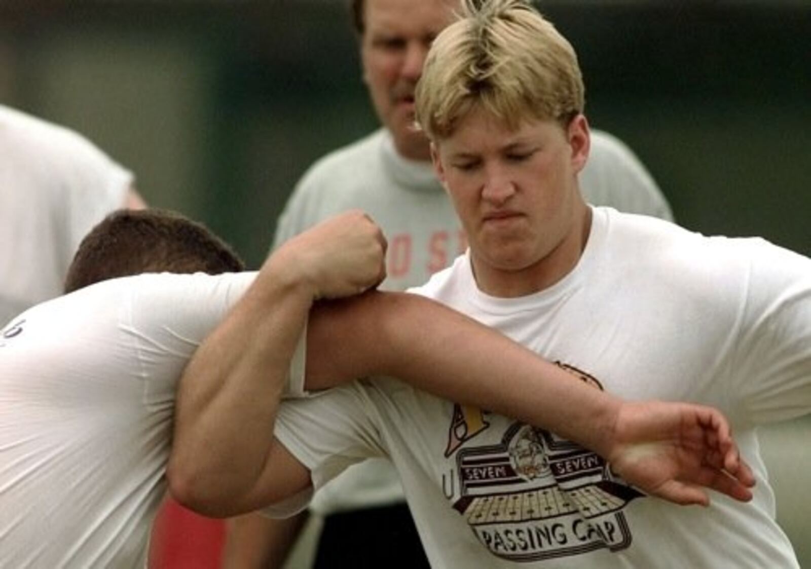 Nick Mangold, right, works out at Ohio State University during a football camp Thursday June 21, 2001 in Columbus.
