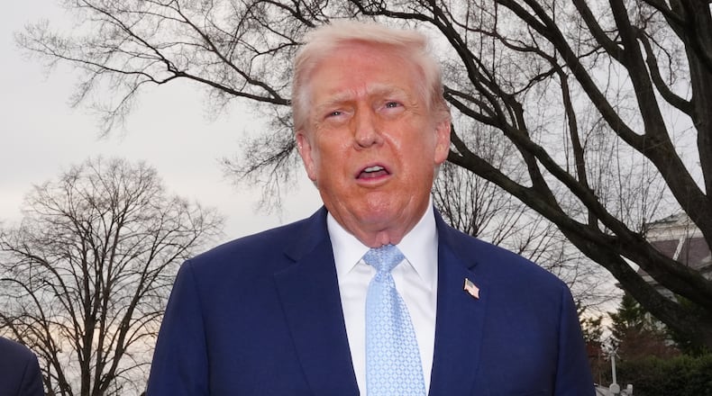 President Donald Trump speaks with reporters before departing on Marine One from the South Lawn of the White House, Friday, March 20, 2026, in Washington. (AP Photo/Alex Brandon)