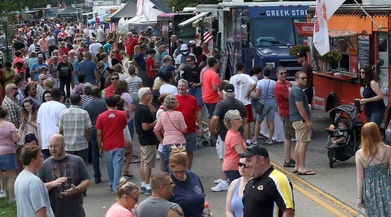 Veteran's Park was overflowing with people Saturday during the Springfield Rotary Gourmet Food Truck Competition. BILL LACKEY/STAFF