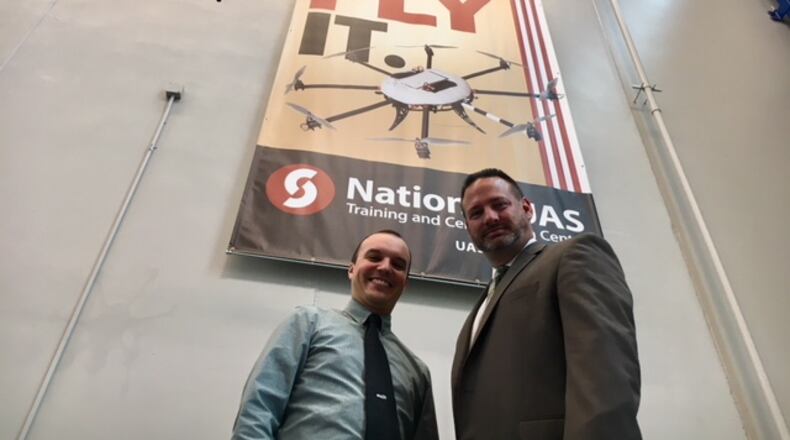 Andrew Shepherd (left), chief scientist and executive director of Sinclair Community College’s Unmanned Aerial Systems Department, and Jeffrey Miller, the department’s chief operating officer, say university research is steadily helping to advance commercial UAV applications. Sinclair will be part of new research into air taxis and delivery drones. THOMAS GNAU/STAFF