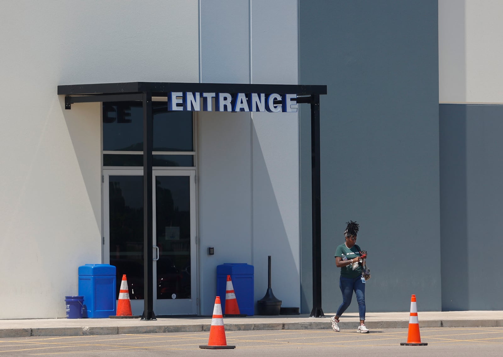 A woman exits Gabe's Distribution Center on Wednesday, June 11, 2025, in Springfield. JOSEPH COOKE/STAFF
