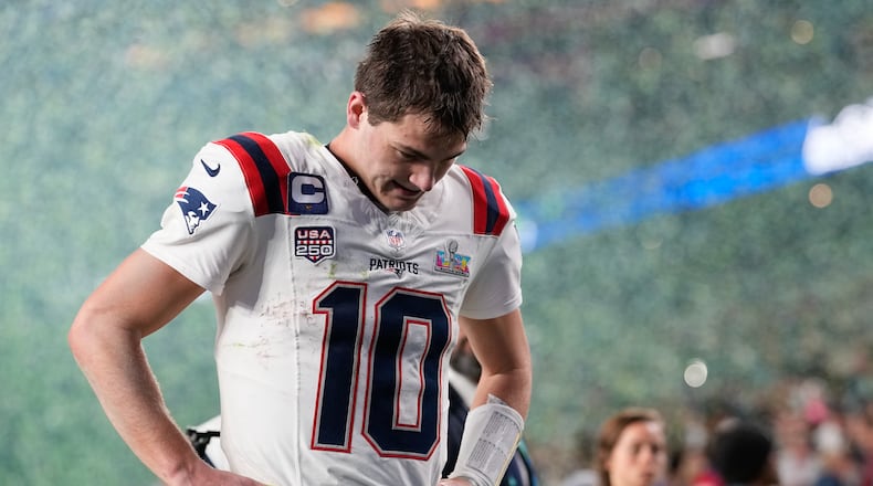 New England Patriots quarterback Drake Maye walks off the field after a loss to the Seattle Seahawks in the NFL Super Bowl 60 football game, Sunday, Feb. 8, 2026, in Santa Clara, Calif. (AP Photo/Julio Cortez)