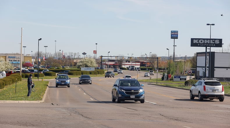 A pedestrian prepares to cross the road on North Bechtle Avenue during the afternoon of Tuesday, April 22, 2025. JOSEPH COOKE/STAFF