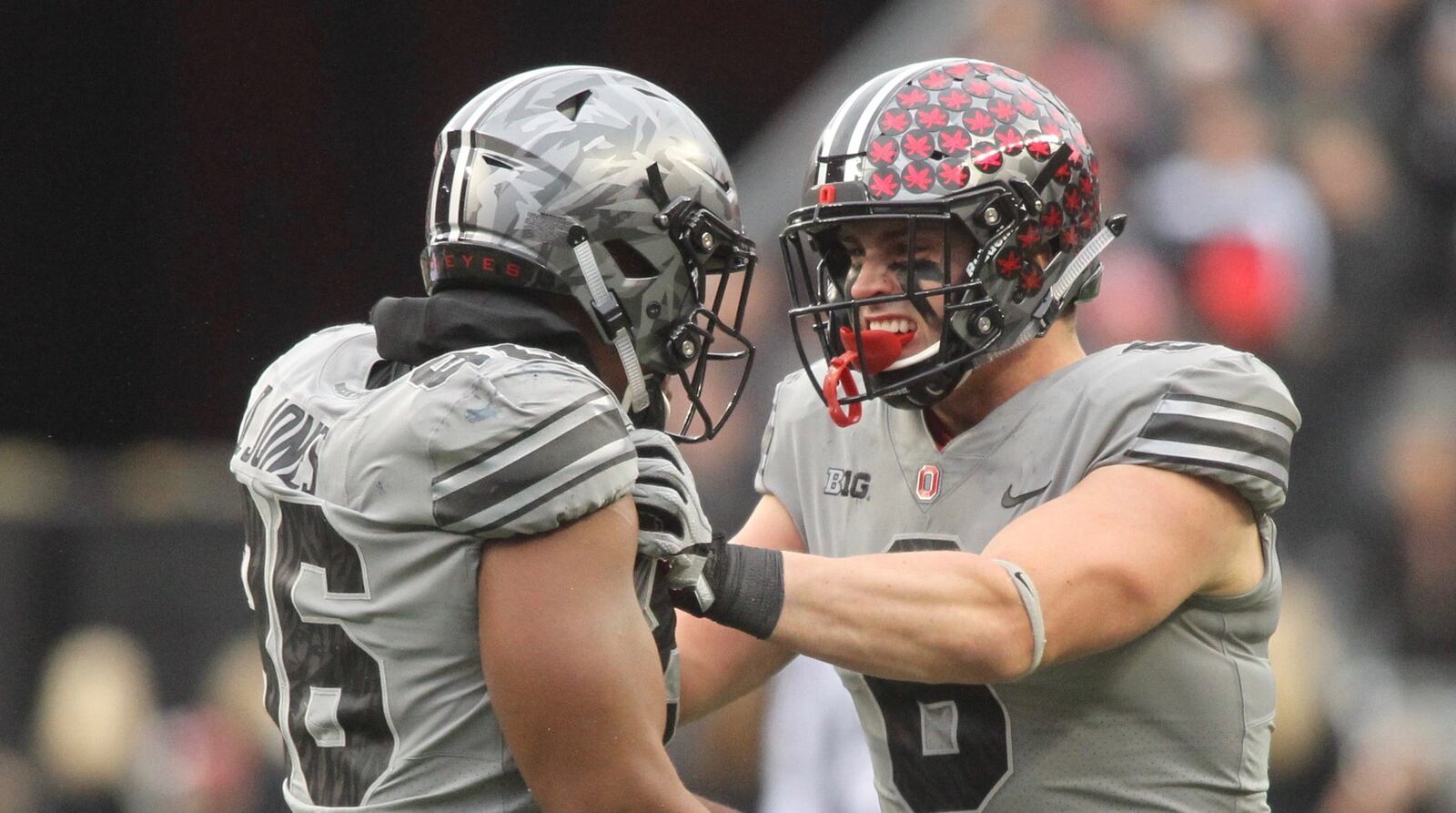 Ohio State’s Sam Hubbard, right, celebrates a tackle with Dre’Mont Jones against Penn State on Saturday, Oct. 28, 2017, at Ohio Stadium in Columbus. David Jablonski/Staff