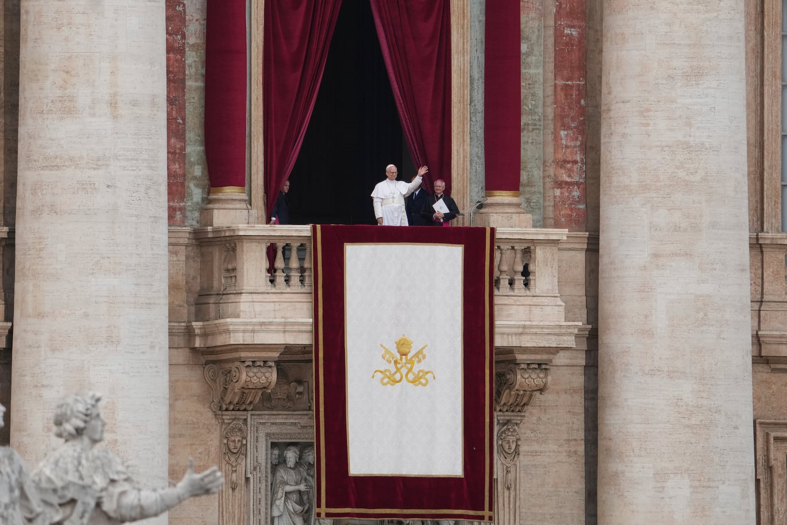 Pope Leo XIV appears at the central balcony of St. Peter's Basilica for his first Sunday blessing after his election, in St. Peter¥s Square at the Vatican, Sunday May 11, 2025. (AP Photo/Alessandra Tarantino)