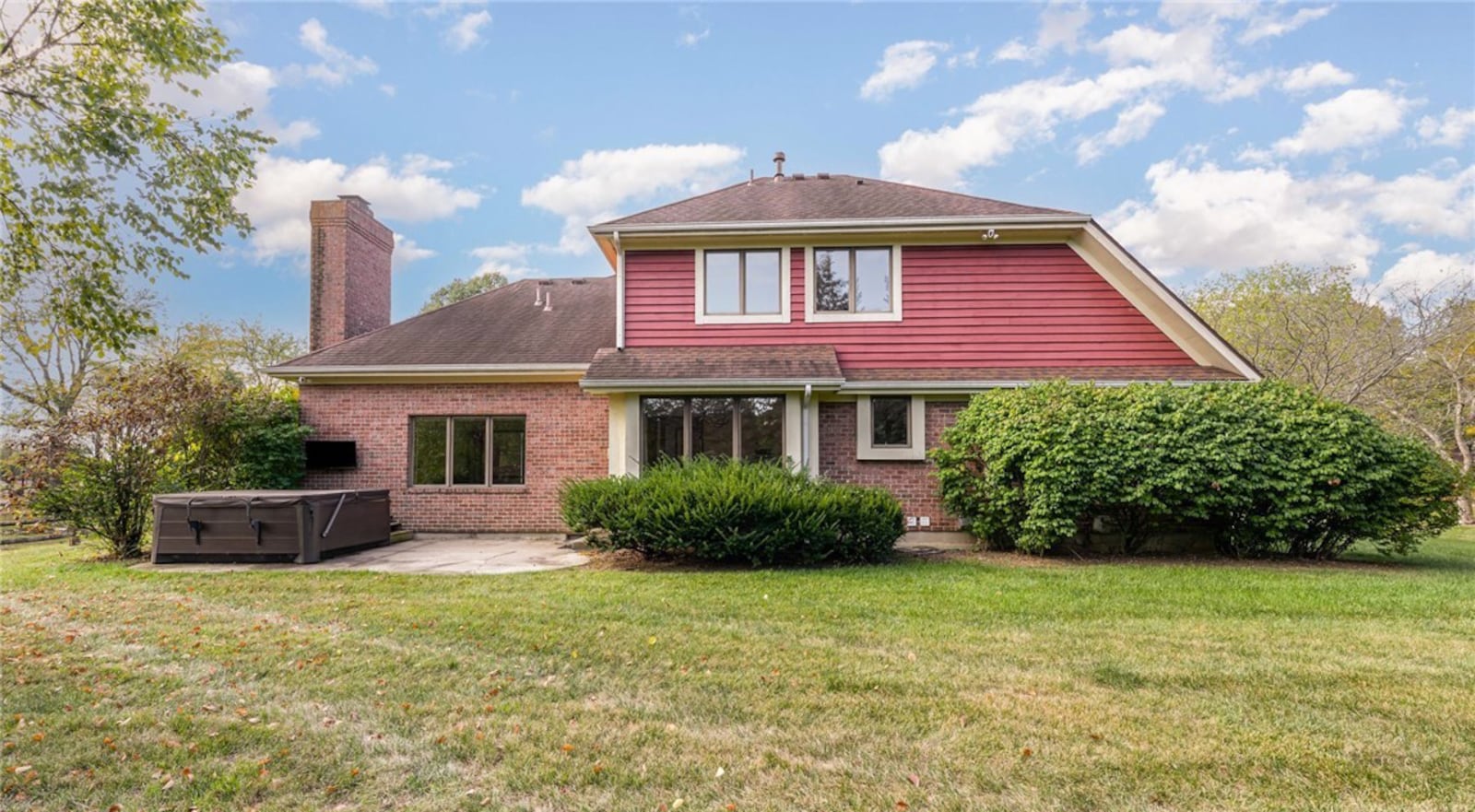 The back of the home has a concrete patio and a Hot Springs hot tub with a wall mounted TV included. There is a wood fence around the back yard. CONTRIBUTED