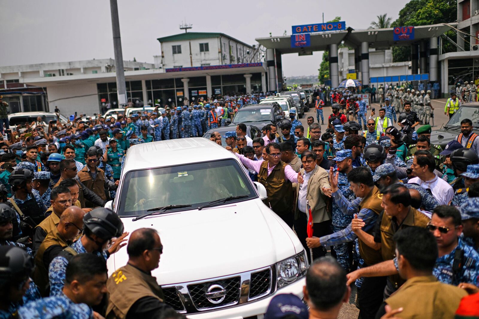 Policemen escort Bangladesh's ailing former Prime Minister Khaleda Zia's motorcade as she leaves from airport after her arrival from London, in Dhaka, Bangladesh, Tuesday, May 6, 2025. (AP Photo/Mahud Hossain Opu)