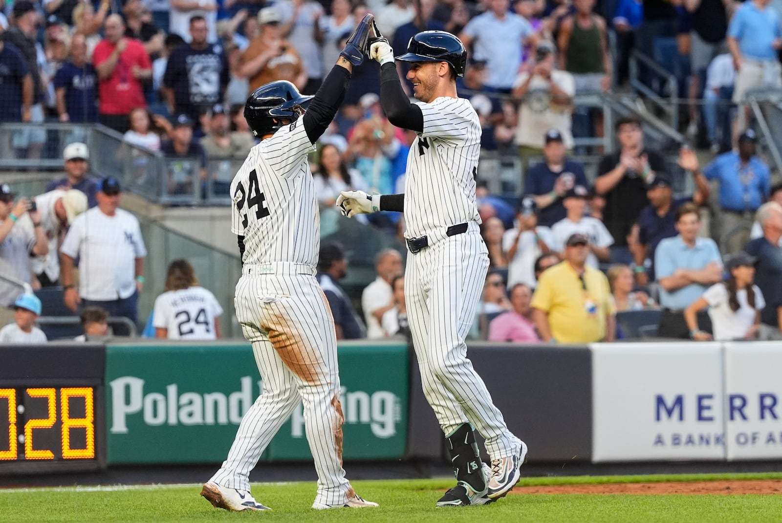New York Yankees' Cody Bellinger, right, celebrates after hitting home run during the third inning of a baseball game against the Chicago Cubs, Friday, July 11, 2025, in New York. (AP Photo/Yuki Iwamura)