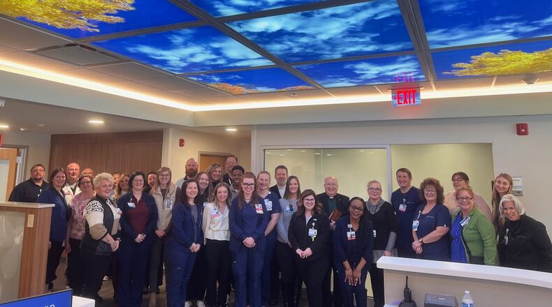 Mercy Health - Urbana Hospital has opened a new Urbana Cancer Center for expanded oncology services in the former McAuley Center long-term care facility. In this photo is the staff as they recently gathered to bless the new center. Contributed