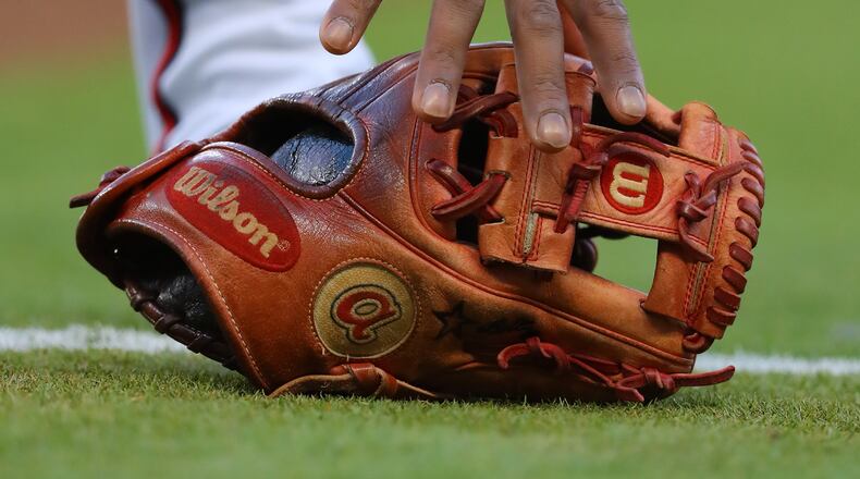 April 18, 2018 Atlanta: Atlanta Braves second baseman Ozzie Albies grabs his glove to begin the first inning against the Phillies in a MLB baseball game on Wednesday, April 18, 2018, in Atlanta. Curtis Compton/ccompton@ajc.com
