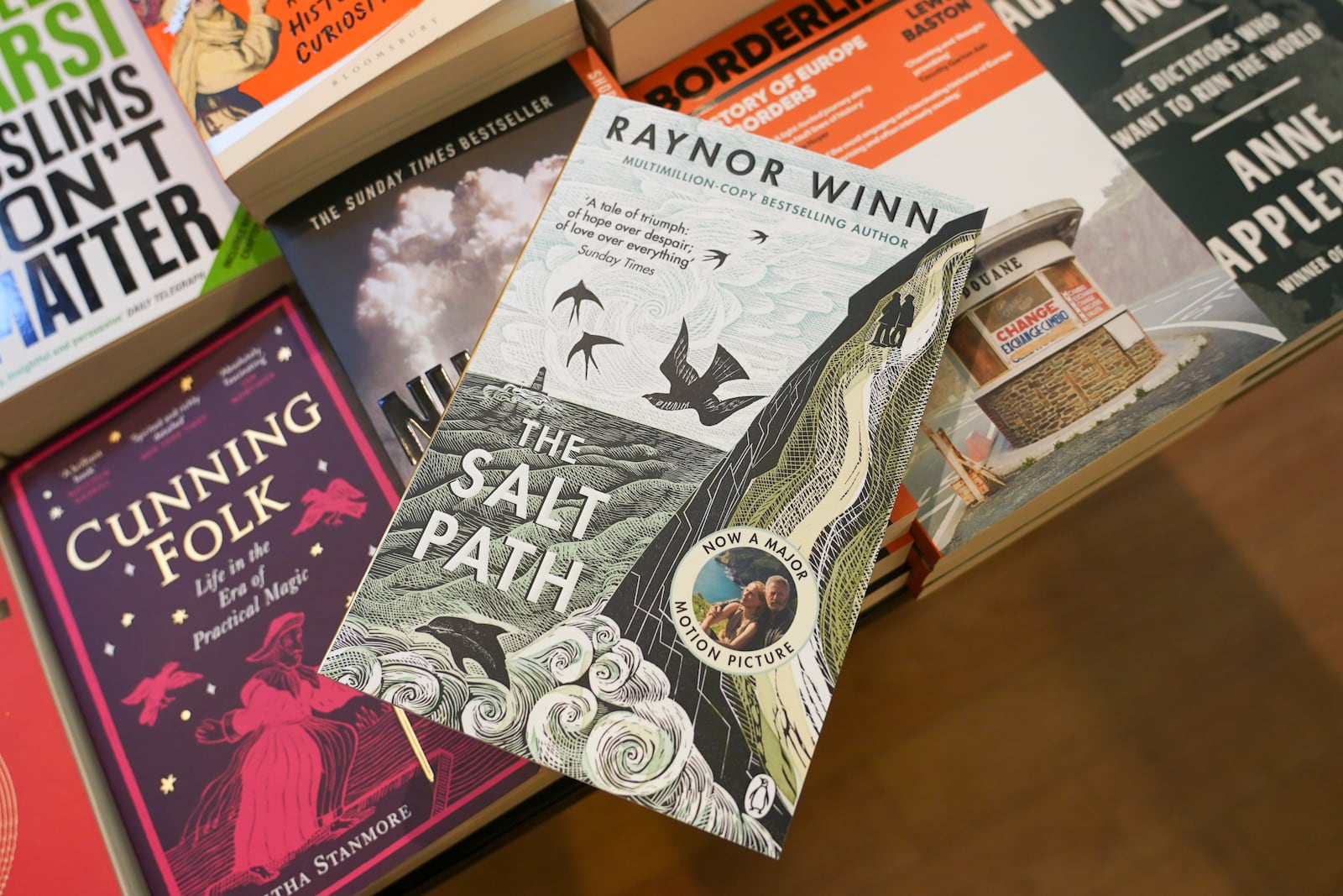 A copy of "The Salt Path", by Raynor Winn is on display in a book store, in London, Friday, July 11, 2025. (AP Photo/Alberto Pezzali)