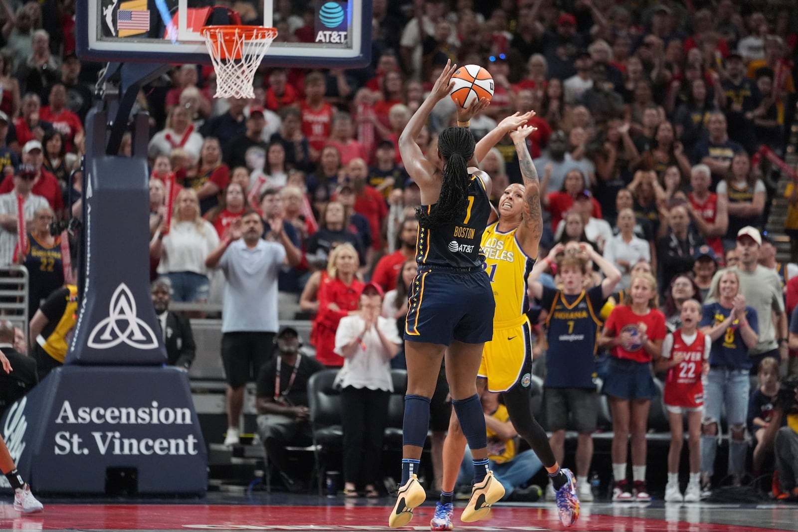 Indiana Fever's Aliyah Boston (7) misses the game tying shot against Los Angeles Sparks' Mercedes Russell (21) during the second half of a WNBA basketball game, Saturday, July 5, 2025, in Indianapolis. (AP Photo/Michael Conroy)