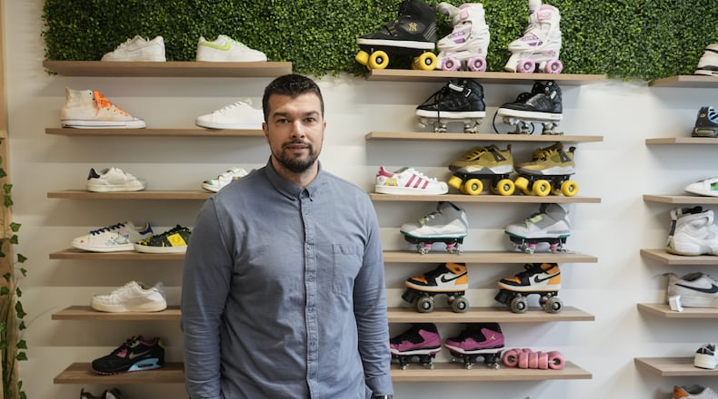 Mohamed Boukhatem, co-founder and director of SneakCoeurZ, a nonprofit organization giving used footwear a second life, poses in Champs-sur-Marne, east of Paris, Wednesday, March 25, 2026. (AP Photo/Thibault Camus)