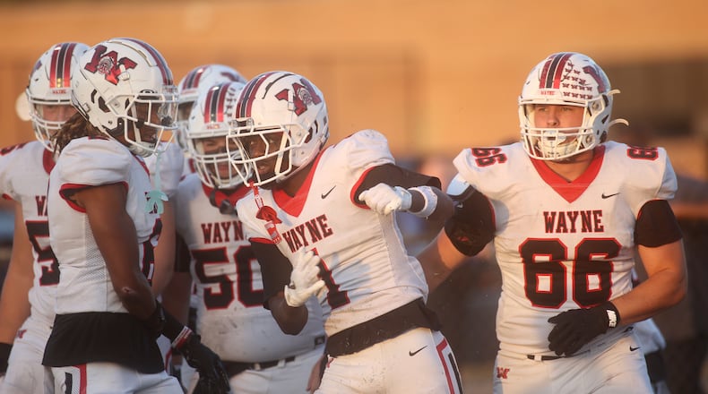 Wayne celebrates a touchdown catch by Jamier Averette-Brown in the first quarter against Fairmont on Friday, Sept. 19, 2025, at Roush Stadium in Kettering. David Jablonski/Staff