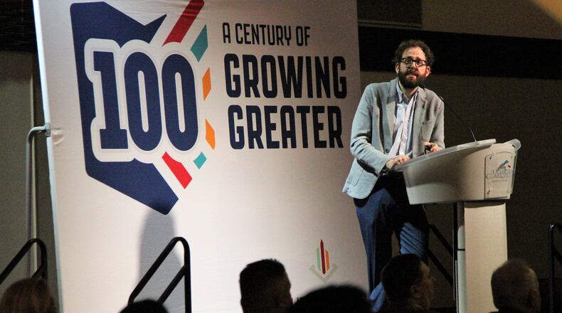 John Reuter, with the organization Strong Towns, served as the keynote speaker for the Chamber of Greater Springfield’s annual meeting on Thursday. He discussed ways communities can make themselves more financially strong and resilient. HASAN KARIM/ Staff