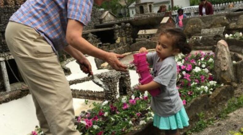 Juliana Longo offers volunteer worker Cheryl Keen assistance during the spring cleanup at Hartman Rock Garden. Brett Turner/Contributed