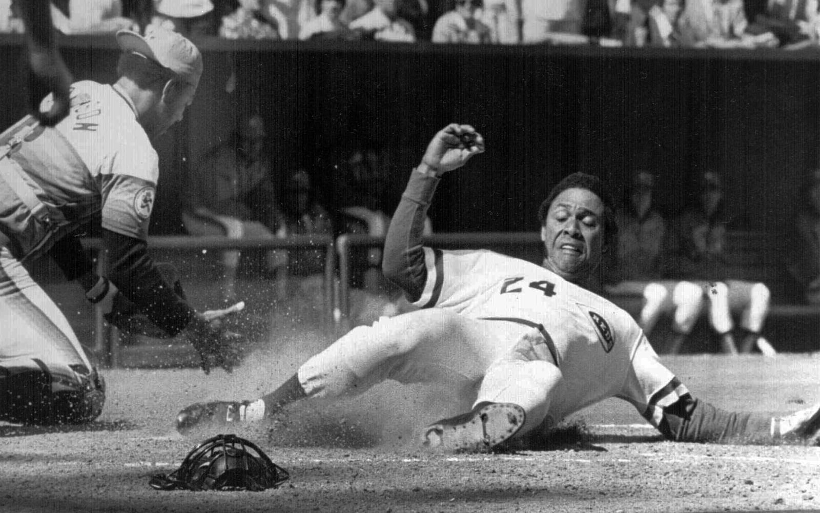 Cincinnati Reds Tony Perez, right, is shown in this April, 1976 file photo during action in the National League season opener. (AP Photo/FILE)