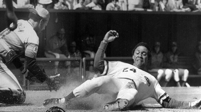 Cincinnati Reds Tony Perez, right, is shown in this April, 1976 file photo during action in the National League season opener. (AP Photo/FILE)