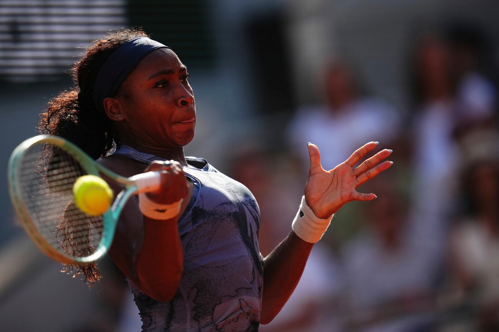 Coco Gauff of the U.S. returns the ball to Marie Bouzkova of the Czech Republic during their third round match of the French Tennis Open, at the Roland-Garros stadium, in Paris, Saturday, May 31, 2025. (AP Photo/Christophe Ena)