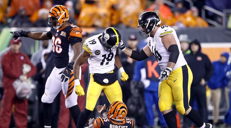 CINCINNATI, OH - DECEMBER 04: JuJu Smith-Schuster #19 of the Pittsburgh Steelers stands over Vontaze Burfict #55 of the Cincinnati Bengals after a hit during the second half at Paul Brown Stadium on December 4, 2017 in Cincinnati, Ohio. (Photo by Andy Lyons/Getty Images)