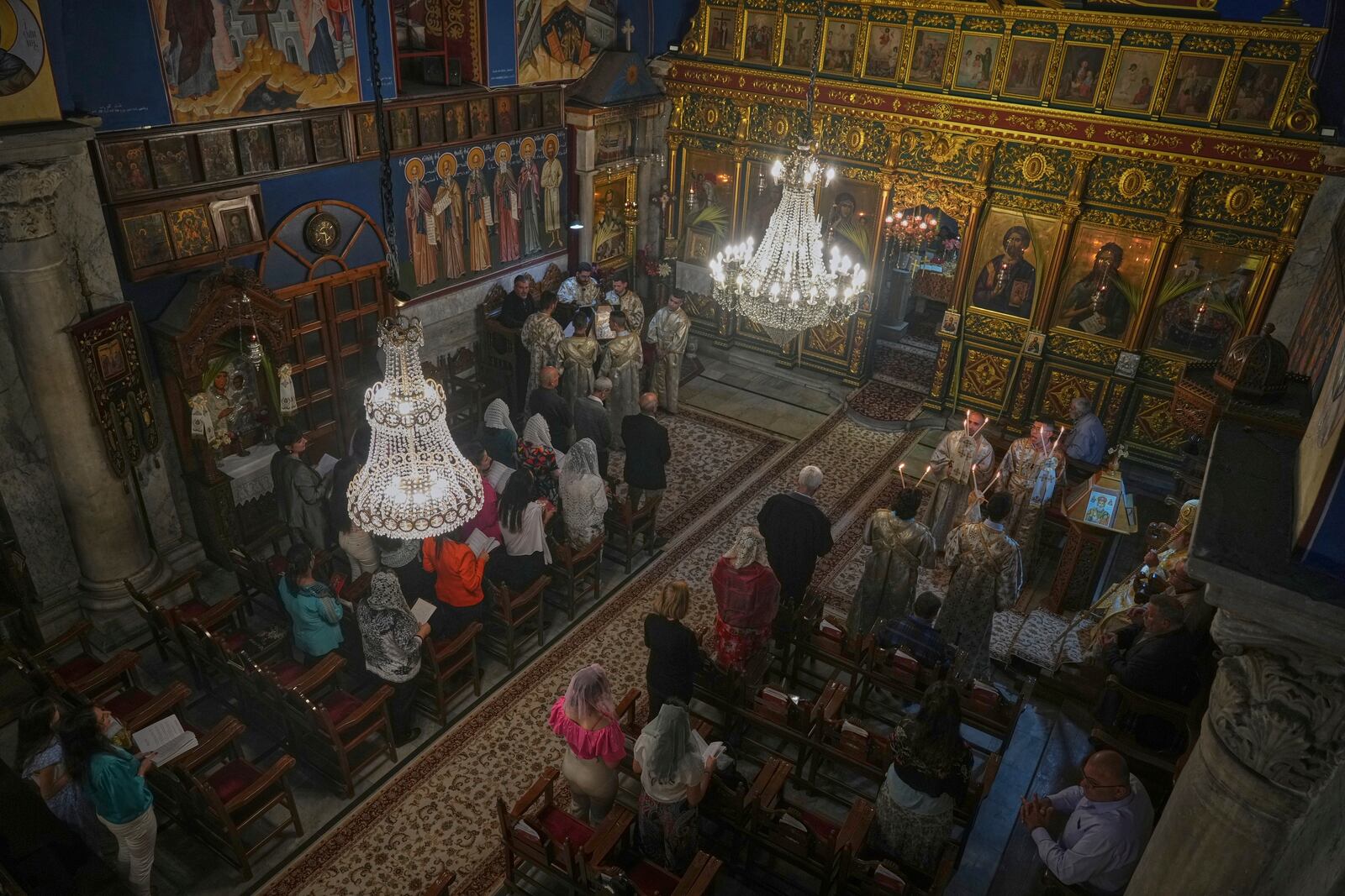 Palestinian Christians attend a Palm Sunday mass at the Greek Orthodox Church of Saint Porphyrius in Gaza City, Sunday, April 13, 2025. (AP Photo/Jehad Alshrafi)