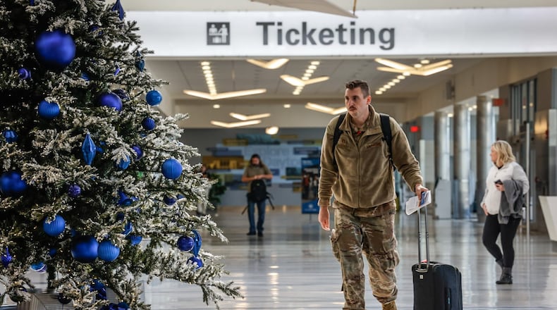 Holiday travelers move through the Dayton International Airport Tuesday, Dec. 12, 2023. AAA projects 4.7 million Ohioans and more than 389,000 Dayton area residents will travel over the 10-day year-end holiday travel period of Dec. 23, 2023 to Jan. 1, 2024. JIM NOELKER/STAFF