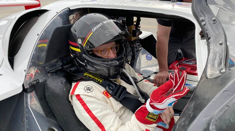 John Higgins gets settled into his 1985 Porsche Fabcar before the start of the Classic 24 at Daytona. Photo by Dale Oakes