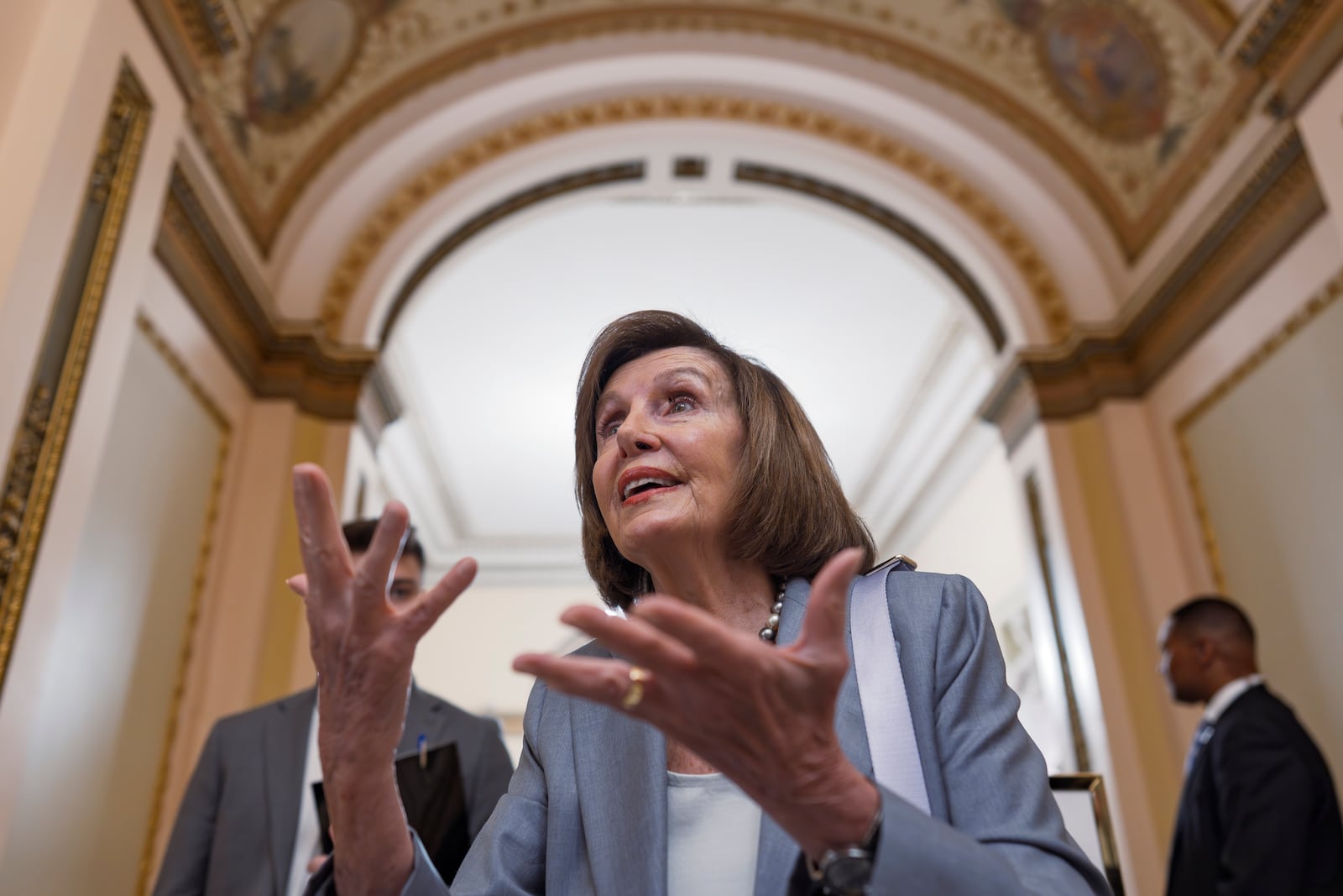 Former House Speaker Nancy Pelosi, D-Calif., pauses for a reporter's question as the Republican majority works to approve President Donald Trump's request to claw back about $9 billion for public broadcasting and foreign aid, at the Capitol in Washington, Thursday, July 17, 2025. (AP Photo/J. Scott Applewhite)