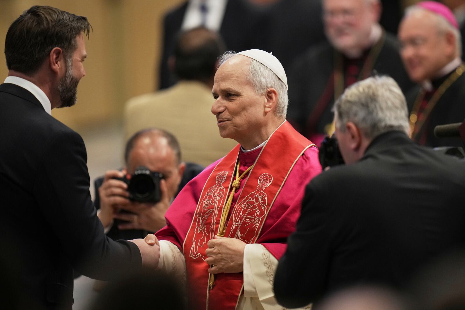 Pope Leo XIV's meets Vice President JD Vance after the formal inauguration of his pontificate in St. Peter's Square, at the Vatican, Sunday, May 18, 2025. (AP Photo/Alessandra Tarantino)