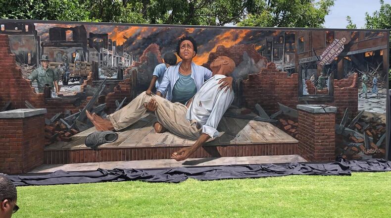 The mural depicting the 1921 Tulsa Race Massacre was painted by artist Michael Rosato and is opposite the Greenwood Cultural Center. CONTRIBUTED