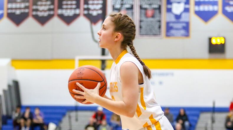 Kenton Ridge’s Kirsten Wiley prepares to shoot the ball during the Cougars D-II sectional game against Shawnee on Tuesday night at Springfield High School. Wiley had a game-high 17 points as the Cougars won 56-26. CONTRIBUTED PHOTO BY MICHAEL COOPER