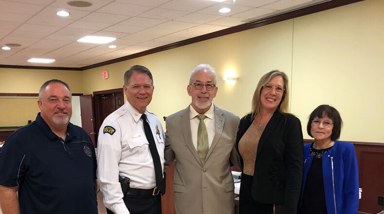 From left: Dayton FOP President and Detective Rick Oakley, Dayton Police Chief Richard Biehl, Alpha-Stim inventor Daniel Kirsch, EPI President Tracey Kirsch and Dayton police psychologist Col Kathy Platoni. HANDOUT
