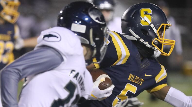 Springfield’s Larry Stephens carries the ball on a kickoff return against Fairmont last season. BILL LACKEY/STAFF