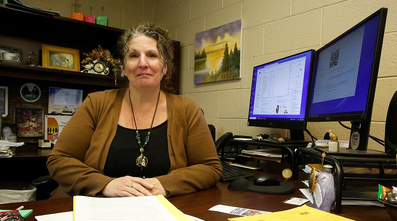 Laura Baxter, executive director of Project Woman, in her office Friday, Feb. 16, 2024. BILL LACKEY/STAFF