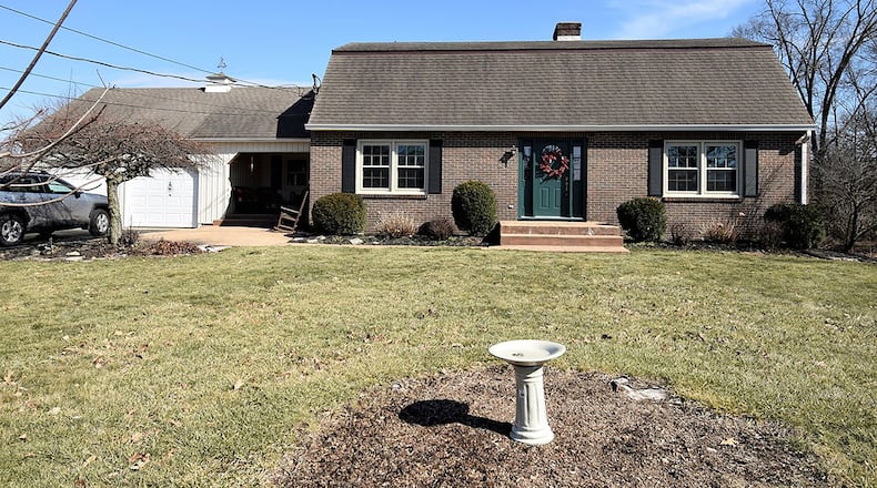 This brick, story-and-a-half home offers about 2,580 sq. ft. of living space, including a full, finished basement with recreation room. The home has 3 bedrooms and an attached, 2-car garage and in-ground pool in back. CONTRIBUTED PHOTO