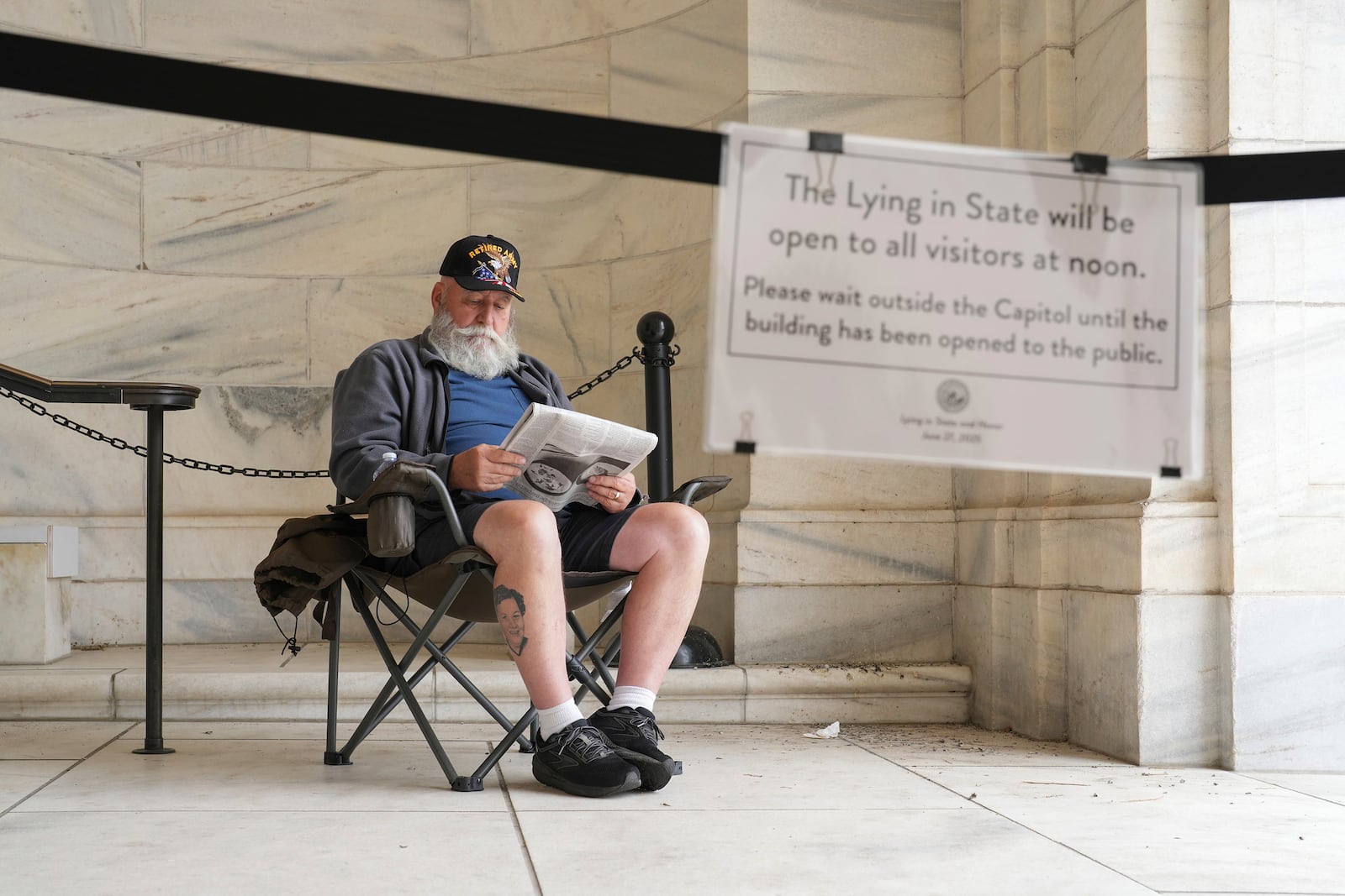 Mike Starr from Oak Grove, Minn. is the first person in line pay his respects to former Minnesota House Speaker Melissa Hortman, who will lie in state with her husband, Mark, and their golden retriever, Gilbert at the Minnesota Capitol rotunda on Friday, June 17, 2025 in St. Paul, Minn. (Alex Kormann/Star Tribune via AP)