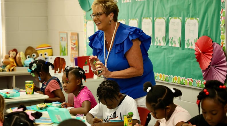 First grade teacher Ms. Kelly Wilson welcomes students to her class at Kenwood Elementary, part of the Springfield City Schools District, during the children's first week back to school. COURTESY OF SCSD