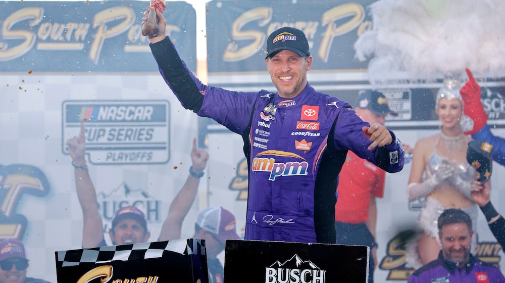 Denny Hamlin celebrates in victory lane after winning a NASCAR Cup Series auto race Sunday, Oct. 12, 2025, in Las Vegas. (AP Photo/Steve Marcus)