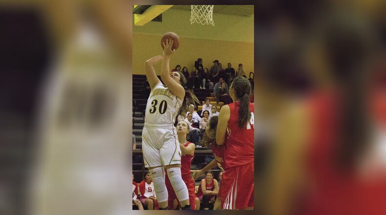 Kenton Ridge junior Mikayla Morris powers inside for two points in the first half of Friday night’s season opener at Kenton Ridge. Jeff Gilbert/CONTRIBUTED