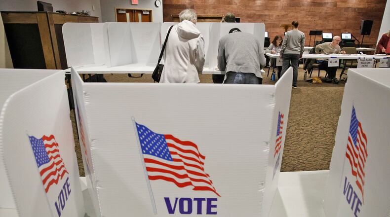 Voting was steady at the election poll in the First Christian Church on Middle Urbana Road Tuesday, March 19, 2024. BILL LACKEY/STAFF