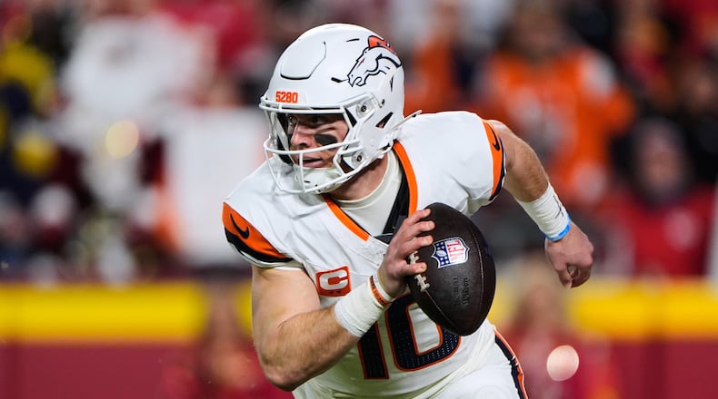Denver Broncos quarterback Bo Nix runs the ball during the first half of an NFL football game against the Kansas City Chiefs, Thursday, Dec. 25, 2025, in Kansas City, Mo. (AP Photo/Charlie Riedel)