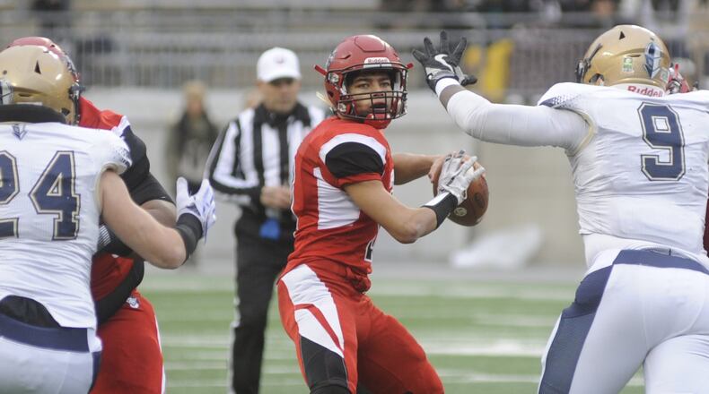 Trotwood QB Markell Stephens-Peppers was under pressure all game. Akron Archbishop Hoban defeated Trotwood-Madison 30-0 in the Division III high school football state championship at Ohio Stadium in Columbus on Saturday, Dec. 3, 2016. MARC PENDLETON / STAFF